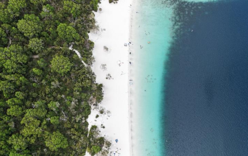 A group of backpackers having fun in the Eli Creek lazy river on K'Gari Fraser Island