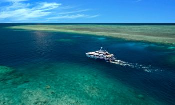 DiversDen dive boat between two reef systems in the middle of the Great Barrier Reef while on a 4 day PADI OpenWater dive course