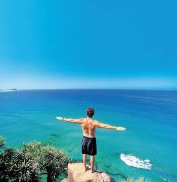 A man on indian head on kgari fraser island as part of the Kgari Explorer tour