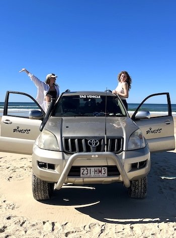 Two female backpackers in 4wd jeeps having a great time on the Dingos 2 day kgari trip