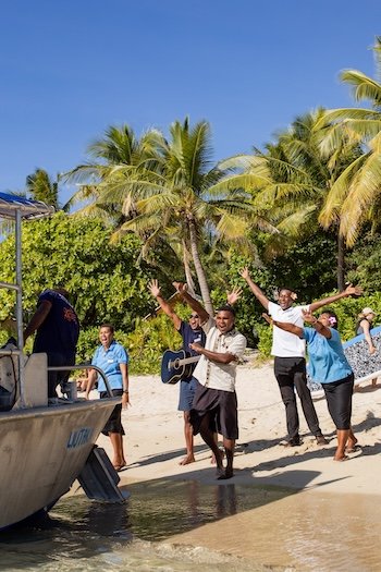 Backpackers receiving a Welcome at Barefoot Manta