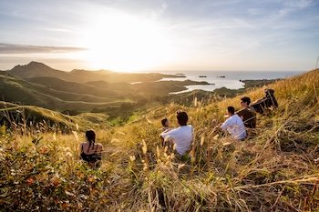 6 backpackers enjoying the view from the top of The hike at Blue Lagoon resort
