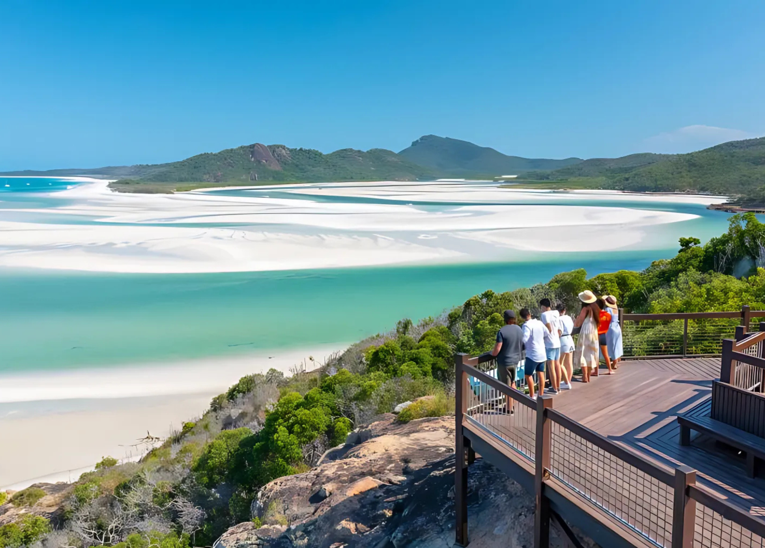 a group of backpackers overlooking a river delta at hill inlet in the Whitsundays