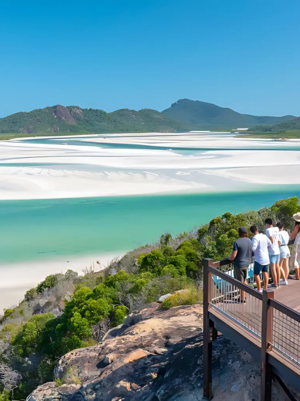 a group of backpackers overlooking a river delta at hill inlet in the Whitsundays