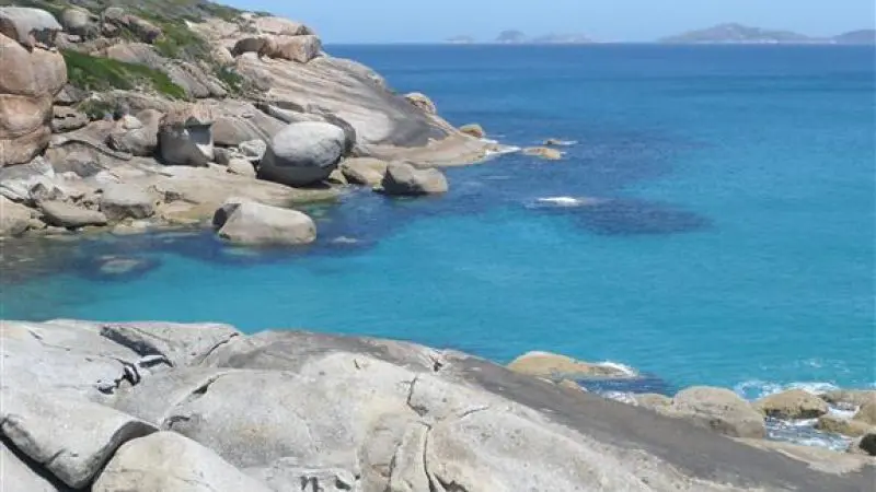 Stunning rocky coastline with massive boulders and vibrant turquoise waters on the 1 Day Wilsons Promontory Tour by Go West Tours.