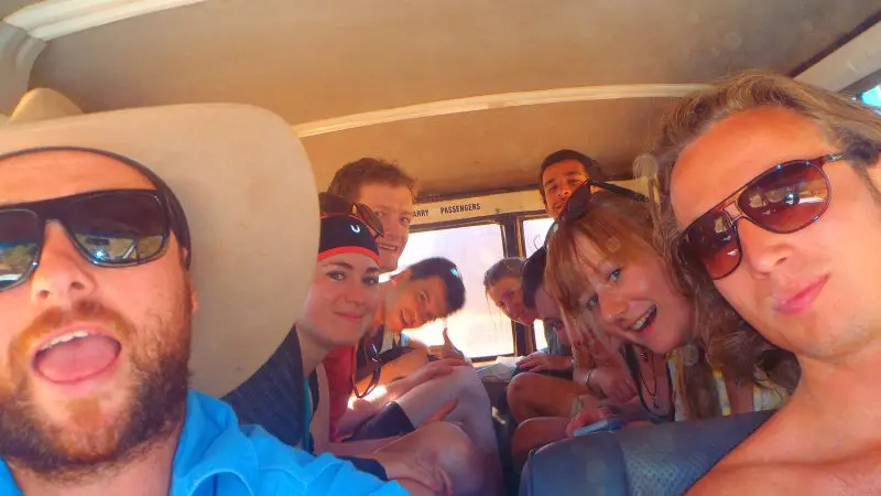 Happy young adults gather for a vibrant selfie on a 3 Day Kakadu Adventure Camping trip, showcasing group smiles and outdoor fun.