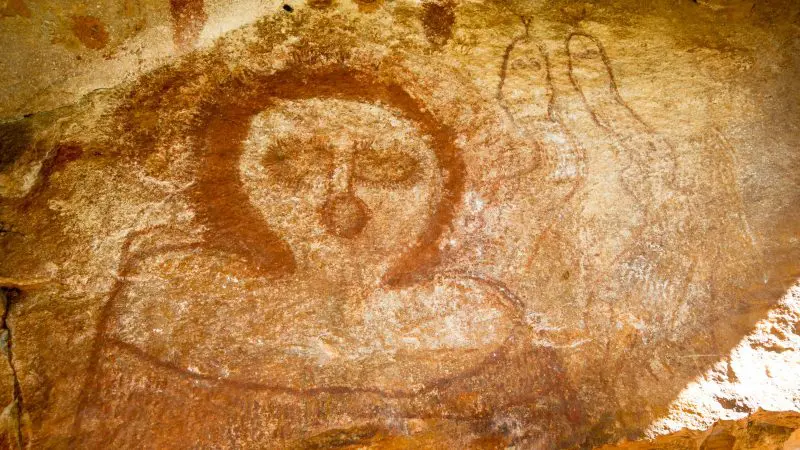 Stunning Aboriginal rock art in red ochre on a 10-day Broome to Darwin Kimberley tour, showcasing ancient Indigenous Australian culture.