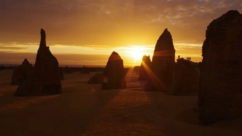 Spectacular desert rock formations glow at sunset on a 6 Day Perth to Exmouth One Way Tour, Western Australia adventure.