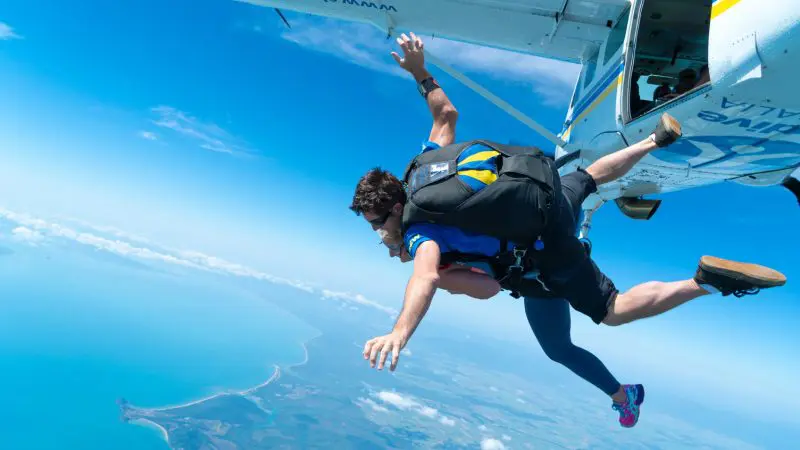 Experience an exhilarating Mission Beach tandem skydive up to 15,000ft over breathtaking coastline, clear blue sky, and ocean views.