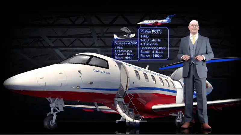 Businessman in suit beside RFDS Darwin Tourist Facility jet, detailed aircraft infographics above, showcasing aviation features.