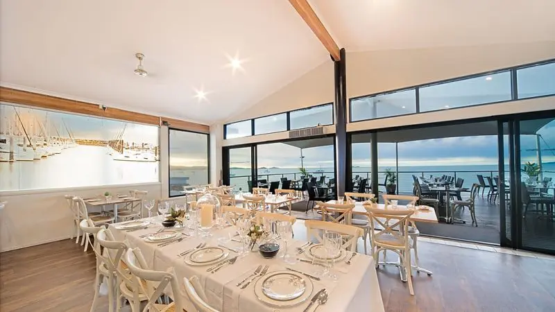 Sorrentos Restaurant offers stunning sea views at sunset, ideal for a Sundowner Cruise and Dine experience in an elegant setting.