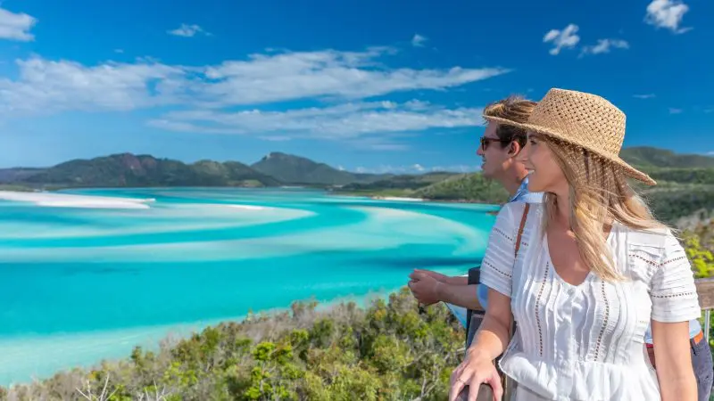 A couple admires stunning coastal scenery on the 16 Day Best of East Coast Australia Comfort Tour departing from Sydney.