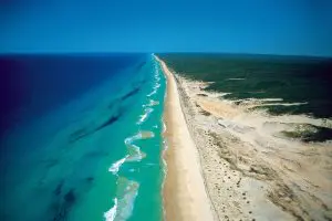 Aerial view of a pristine sandy beach on Kgari Coast called 75 mile beach 