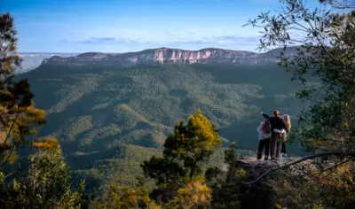 A drone shot of people at a lookout in the Blue Mountains in NSW,