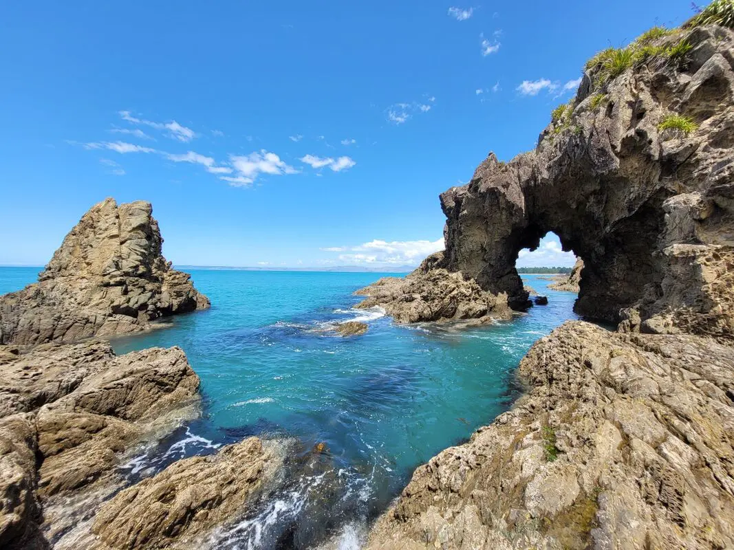 clear blue water and rock formations around it