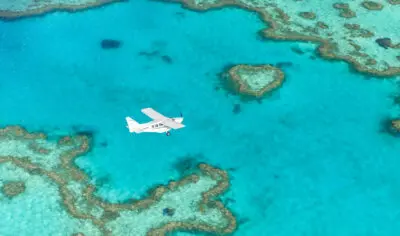 Picture of a scenic flight flying over the heart reef in the Whitsundays tropical islands