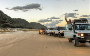 Picture of a group of backackers driving in 4x4 vehicles on K'gari Fraser Island on a Tag Along Tour