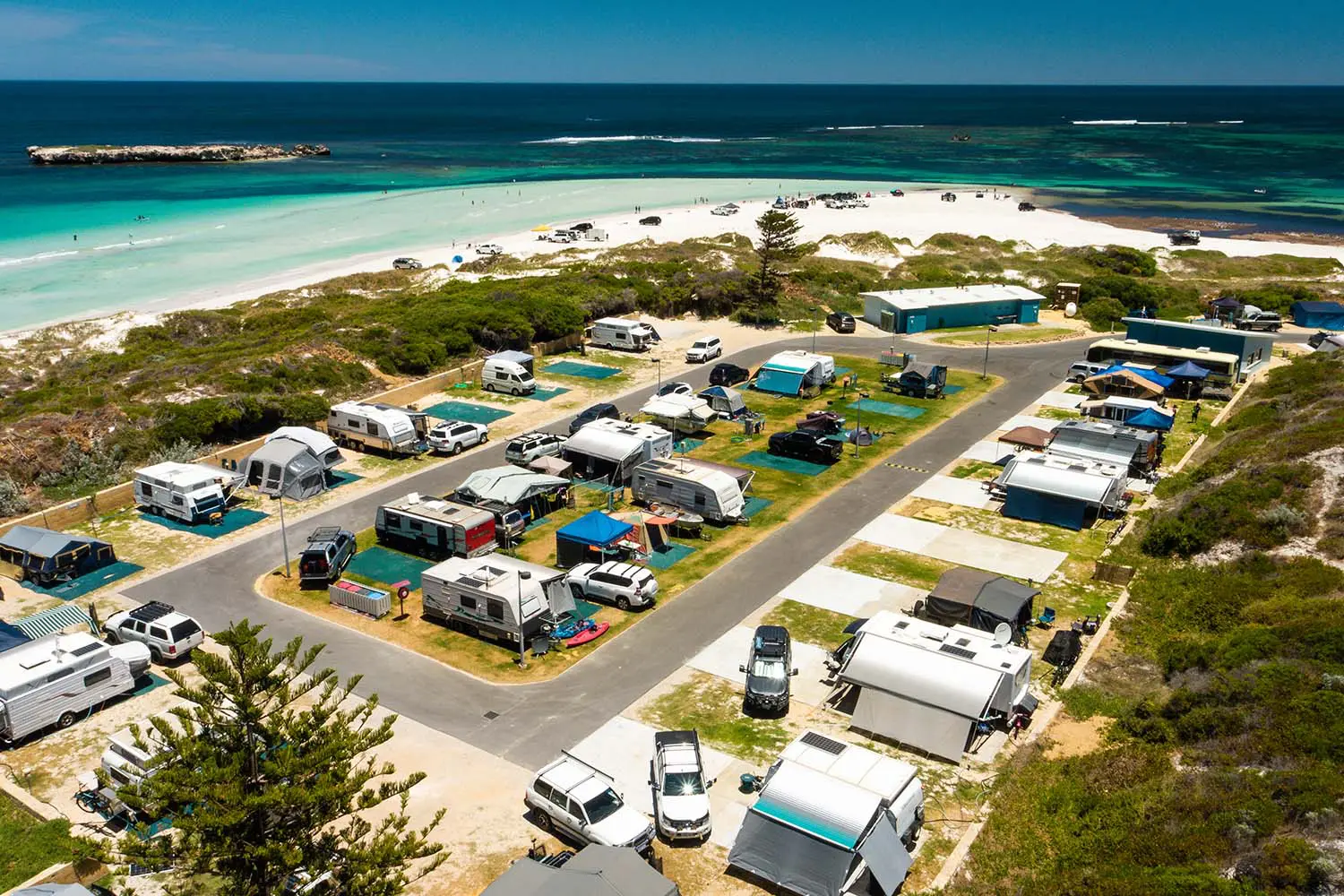campervan park located right on the coast of bright blue waters