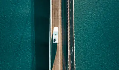 Apollo Euro Deluxe driving on bridge birds eye view