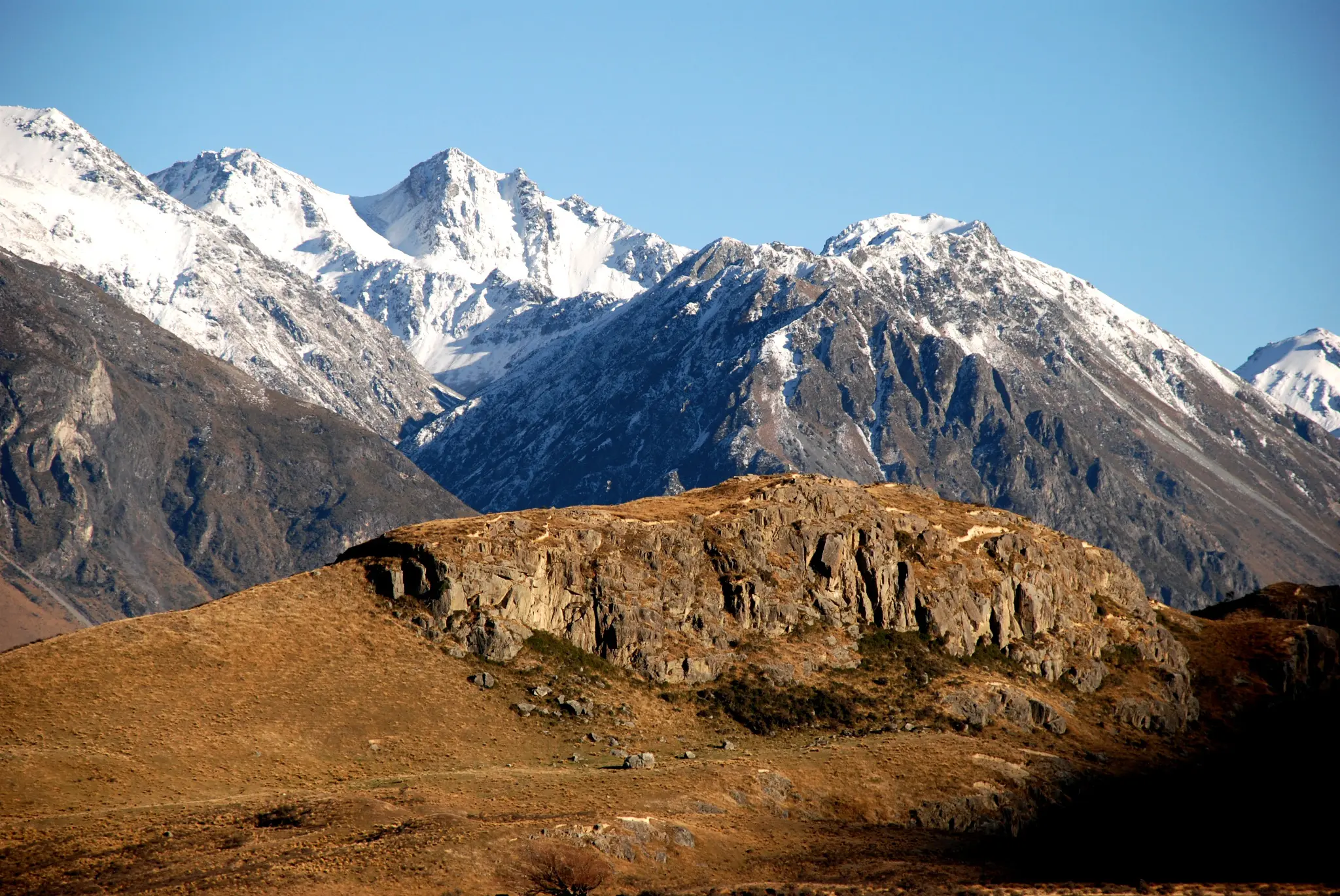 mountain peaks with snowcaps in the daytime
