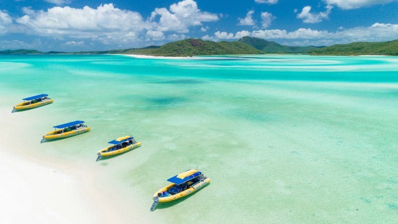 Three boats at whitehaven beach