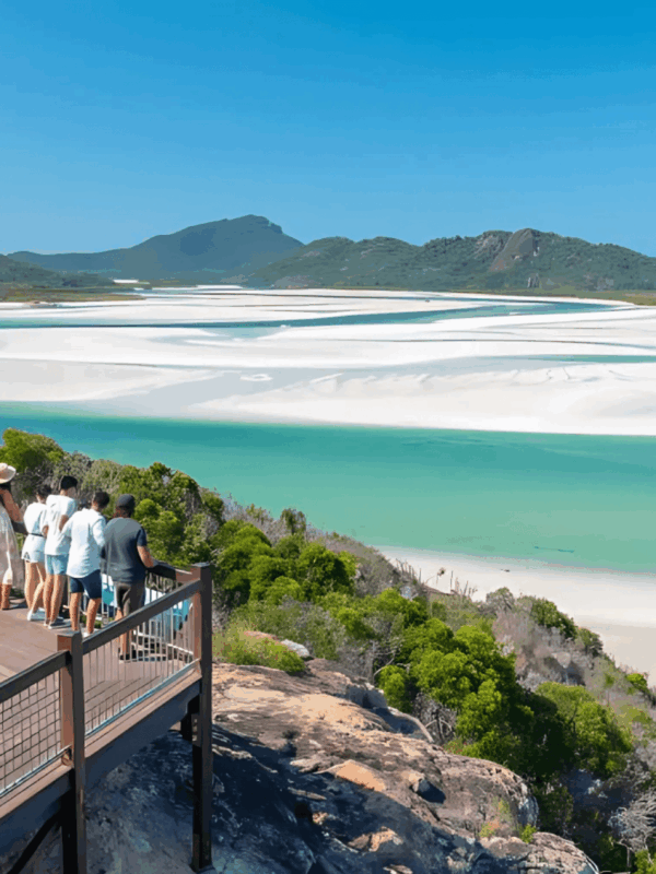 a group of backpackers overlooking a river delta at hill inlet in the Whitsundays