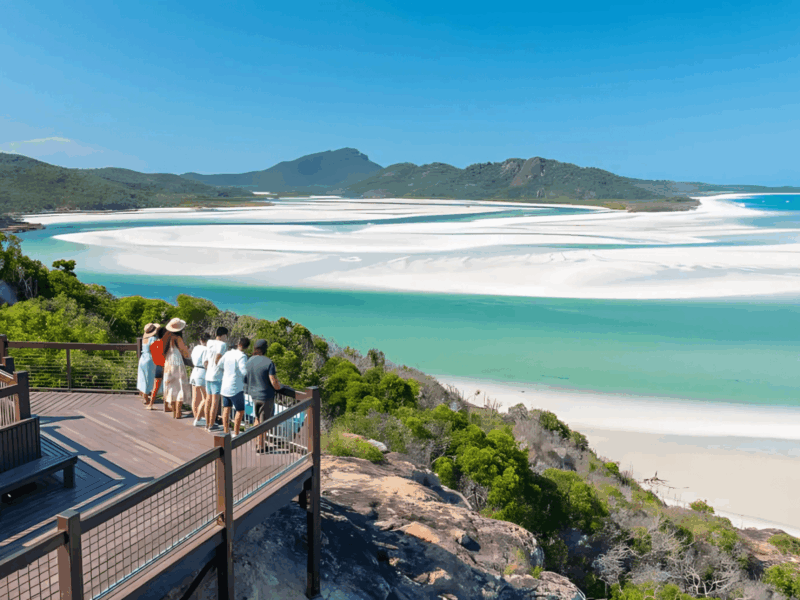a group of backpackers overlooking a river delta at hill inlet in the Whitsundays