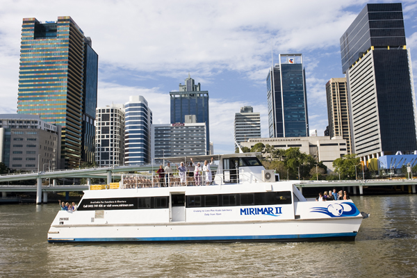 Scenic white river cruise boat with passengers provides return journey to Lone Pine Koala Sanctuary, entry ticket included.