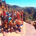 Group explores dramatic rocky cliffs and gorges on a 3-day 4WD Kakadu Adventure Tour, June–September, with scenic views.
