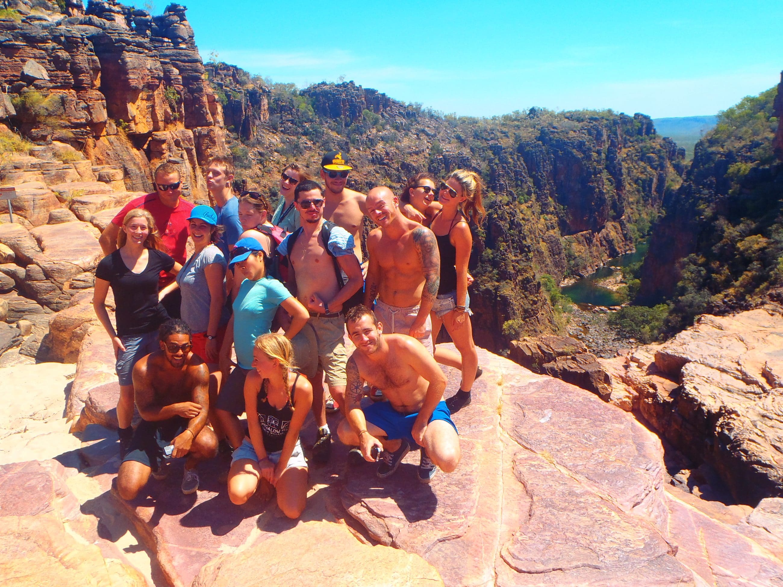 Group explores dramatic rocky cliffs and gorges on a 3-day 4WD Kakadu Adventure Tour, June–September, with scenic views.