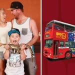 Surprised family with a snake beside a red Big Bus tour, featuring Crocosaurus Cove branding and Croc Explorer Ticket flags visible.