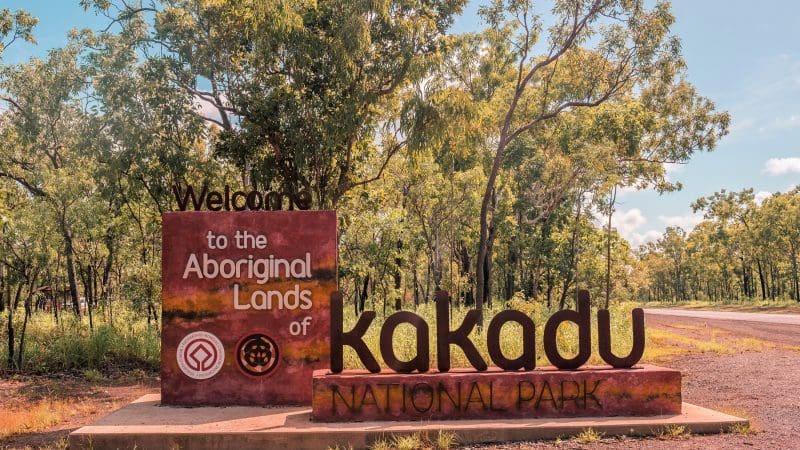 Kakadu National Park welcome sign by roadside, greeting guests on 3-Day Kakadu Litchfield National Park 4WD Safari Tour.