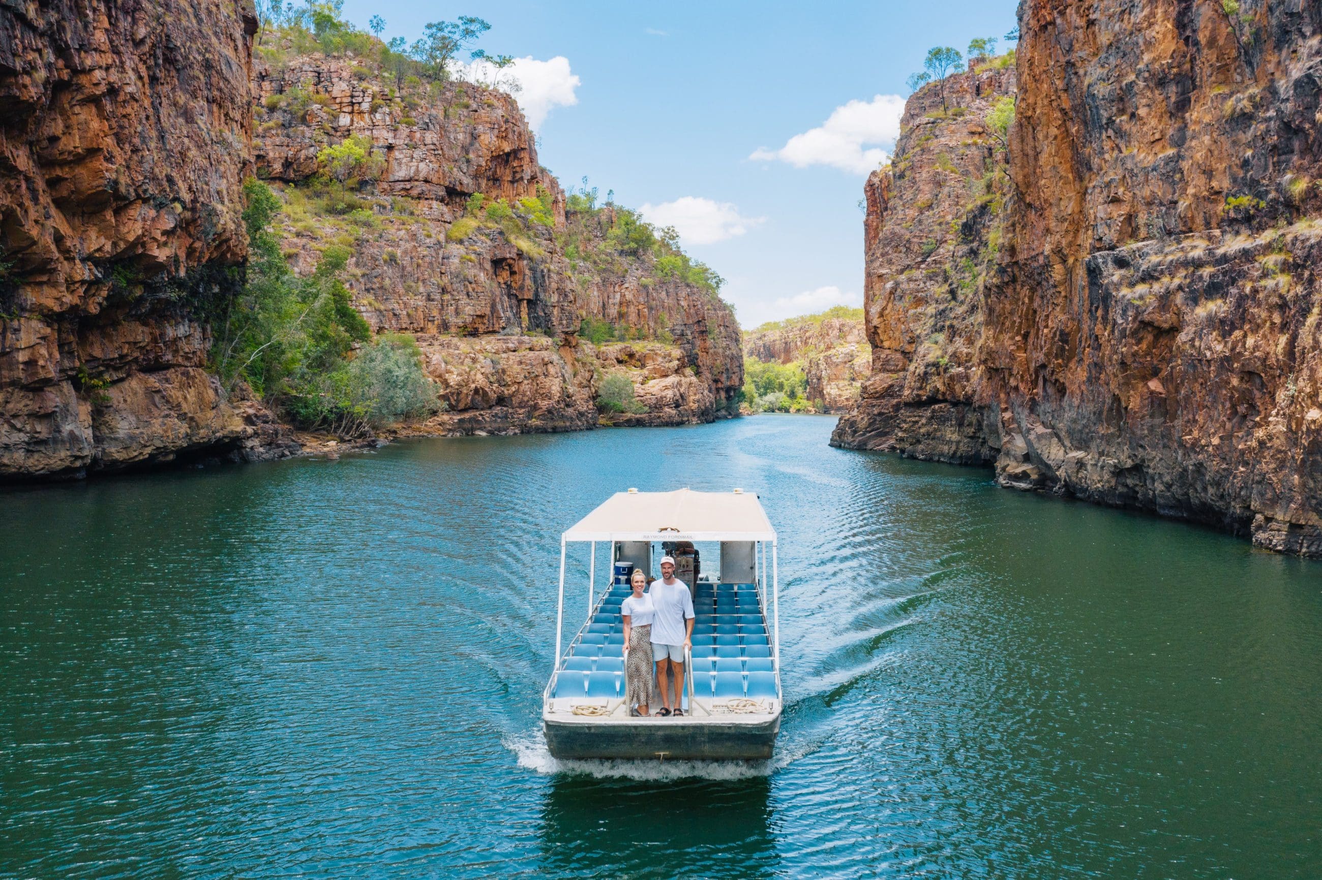 A scenic boat tour glides through Katherine Gorge’s emerald waters—top-rated 1 Day Cruise adventure, just a short trip from Darwin.
