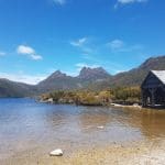 Scenic rustic boathouse on crystal-clear lake at Cradle Mountain, featured on a top-rated 2-Day Hobart tour with Wild Tasmania Tours.
