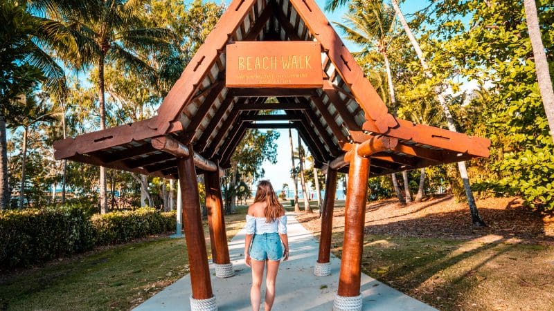 Woman exploring wooden pavilion during Fully Guided Ultimate East Coast Sydney to Cairns 3 Weeks 2 Tour Adventure, Australia.
