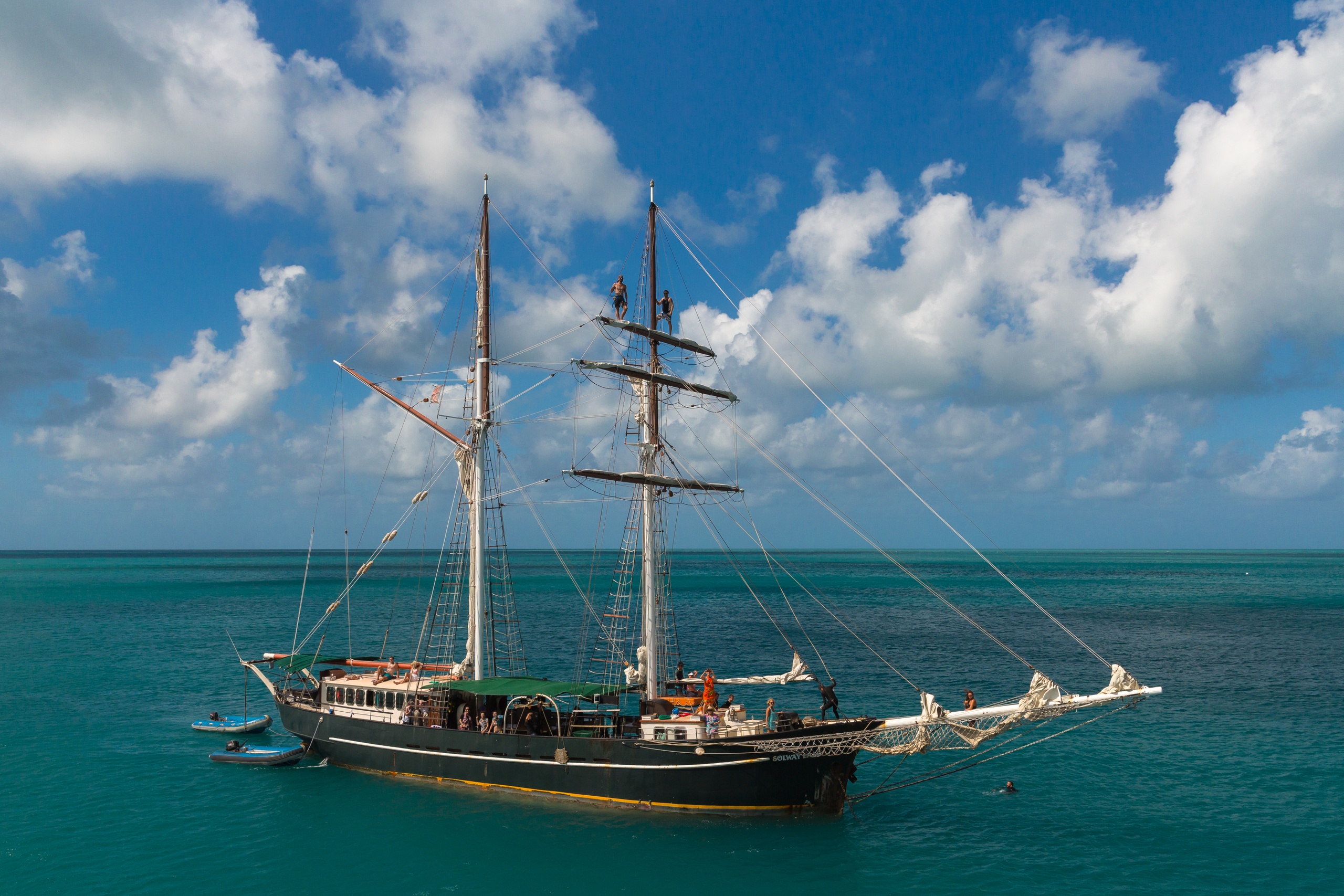 Experience the iconic Solway Lass: a majestic tall black ship cruising Whitsunday’s turquoise waters for 3 days, 2 nights under blue skies.