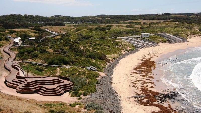 Curved boardwalk with scenic sea views at Phillip Island, ideal for 1 Day Penguin Parade Koalas Tour and General Viewing experience.