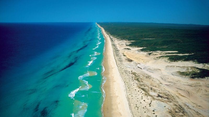 Aerial view of a pristine sandy beach on Kgari Coast called 75 mile beach