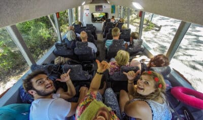 a grop of backpackers exploring K'gari on a bus with Peterpans