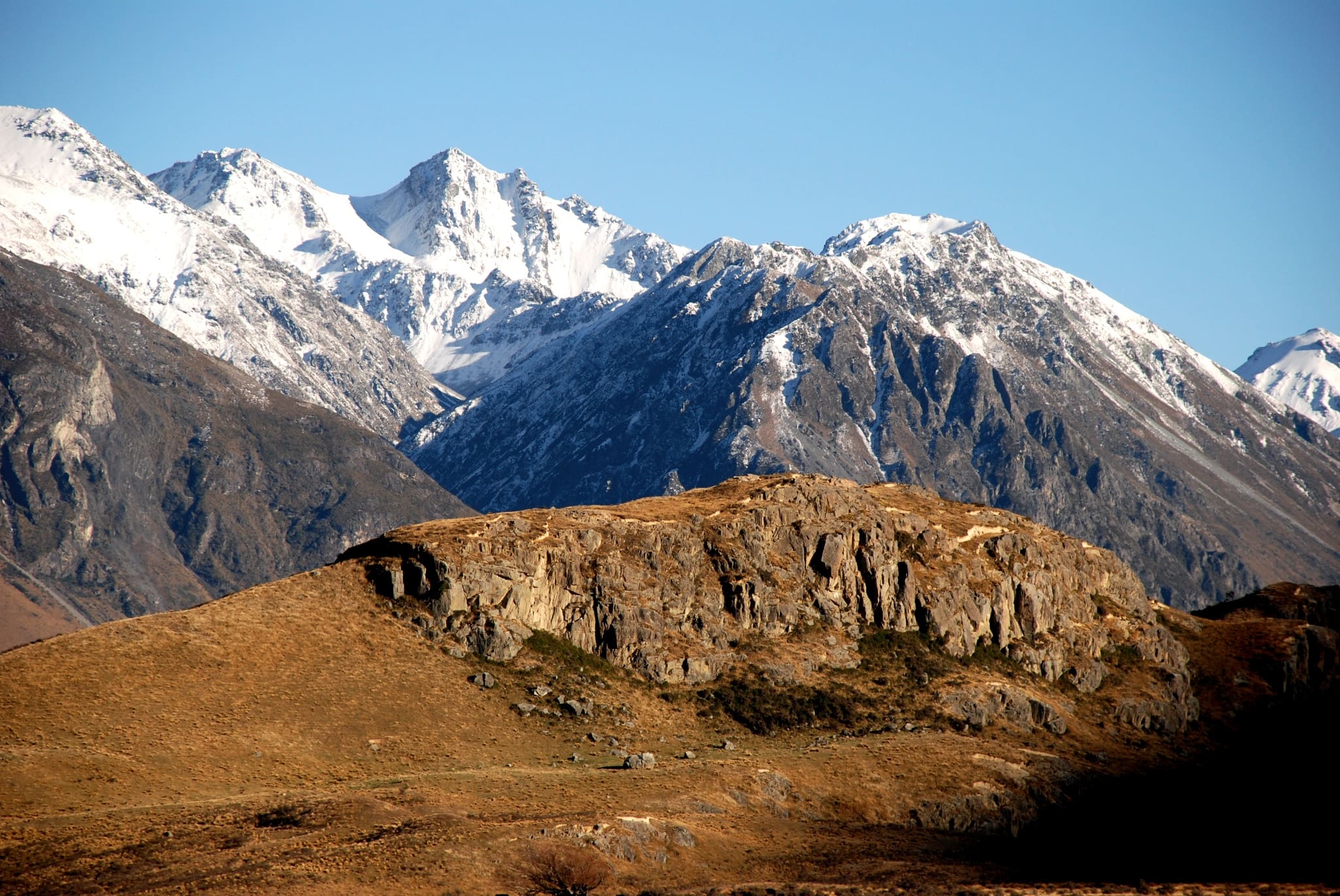 mountain peaks with snowcaps in the daytime