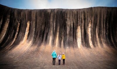 6a38d77f7a4a0_725_twa-family-standing-on-wave-rock-landscape-119152-56-resized